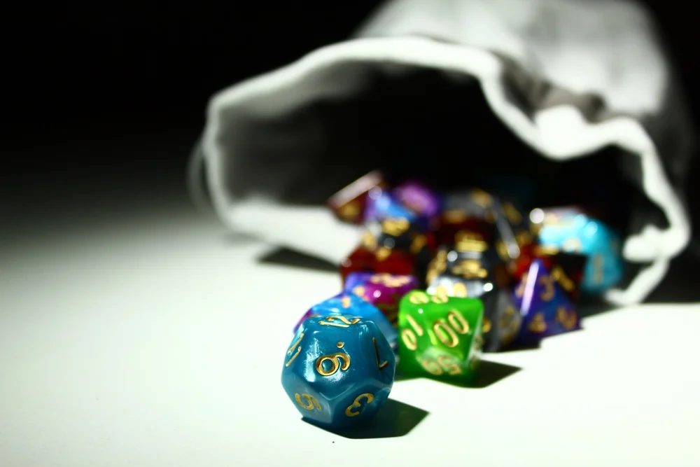 Dice spilling from a bag